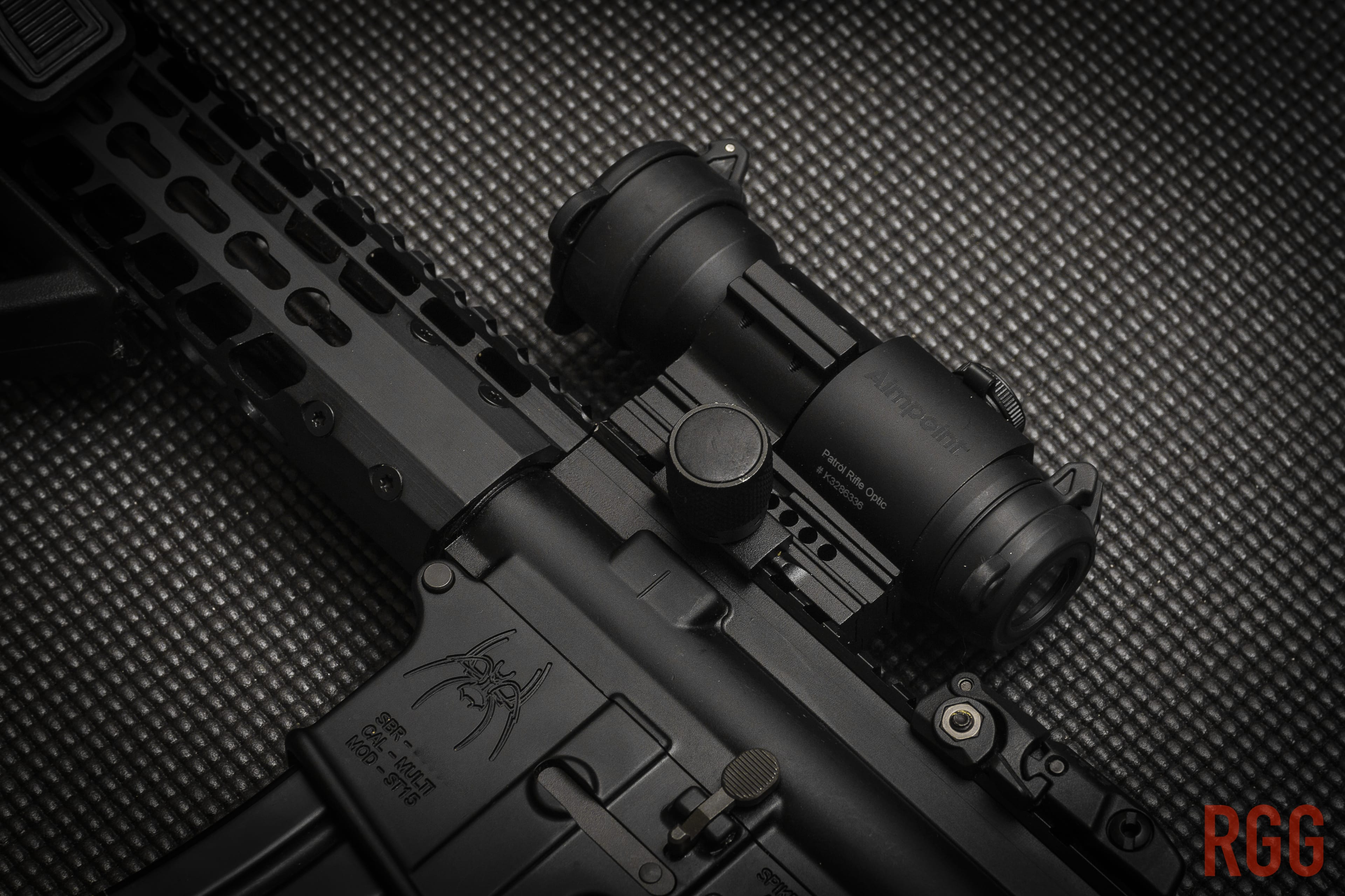 An AR15 with an Aimpoint PRO red dot sight.