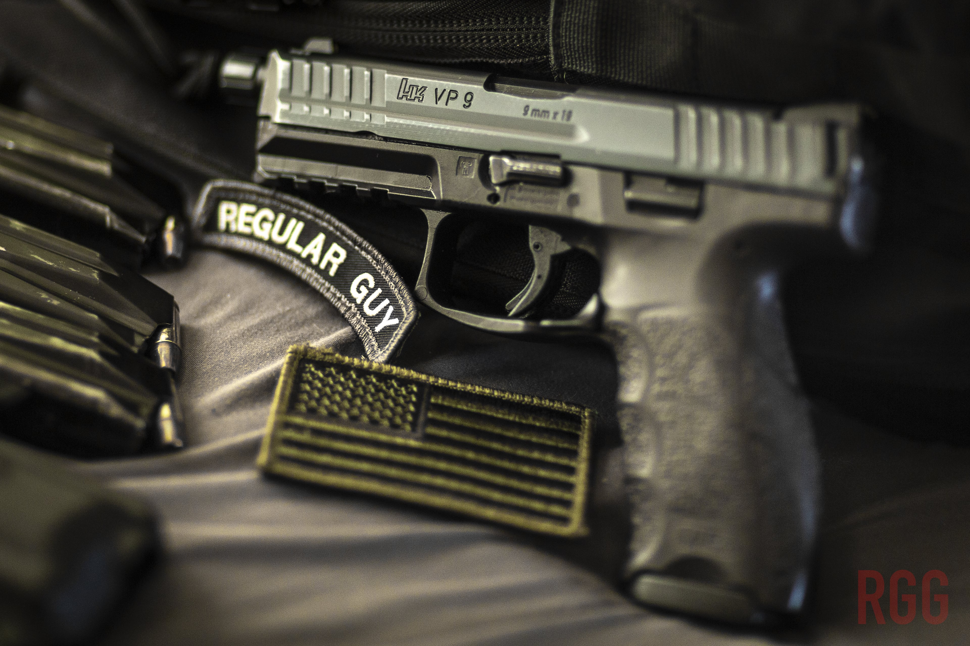 A Heckler & Koch VP9 9mm pistol with spare magazines. 